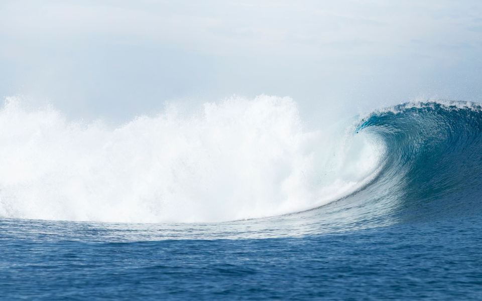 A clean open barrel at Cloudbreak, Fiji